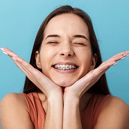 A smiling woman wearing braces