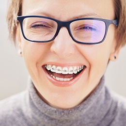 A young girl smiling with braces