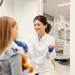 an orthodontist consulting with a patient