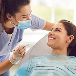 an orthodontist examining a patient’s teeth