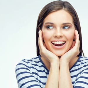 A young woman with clear braces