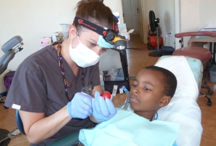 Dr. Justyna working with young patient