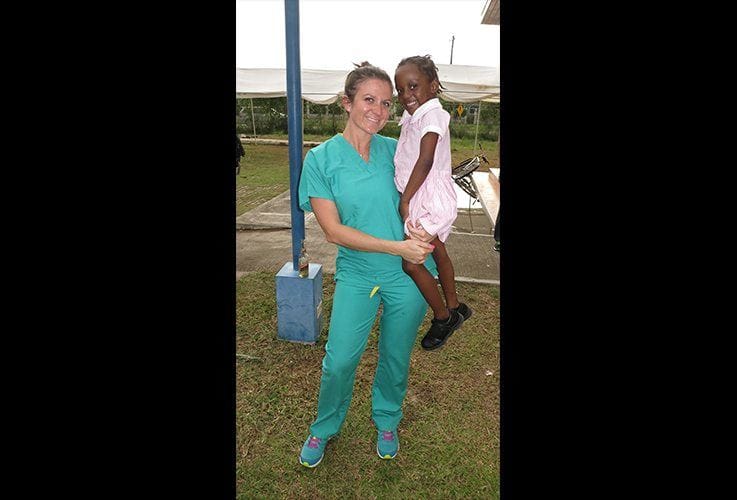 Smiling team member and young patient