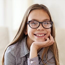 Smiling young girl with glasses