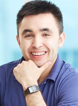 Adult man with ceramic braces