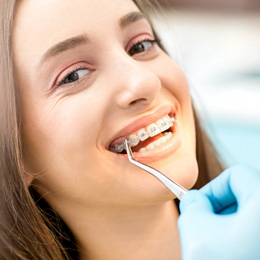 Woman smiling during orthodontic checkup