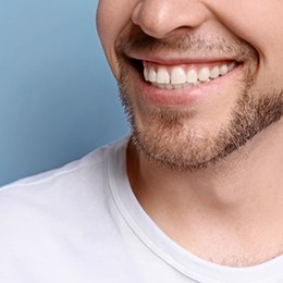 a man smiling with straight teeth