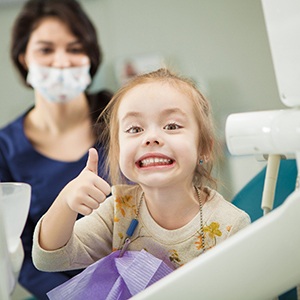 Girl smiling in the dental chair