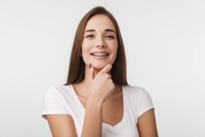 Young woman smiling with braces