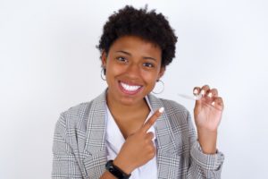 woman holding removable retainer